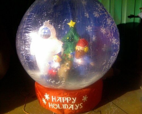 Giant snow globe "Happy Holidays" blow up party decoration with Abominable Snowman.
