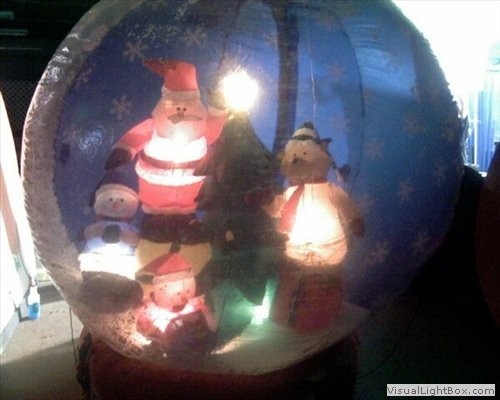 Large Santa snow globe prop for rental.